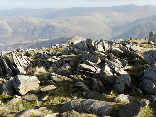 Rock strewn path on top of Hart Crag and the view to the east descending from Fairfield.