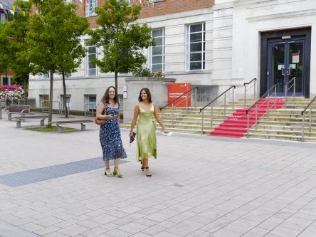Lucy with Maddie about to collect their gowns.